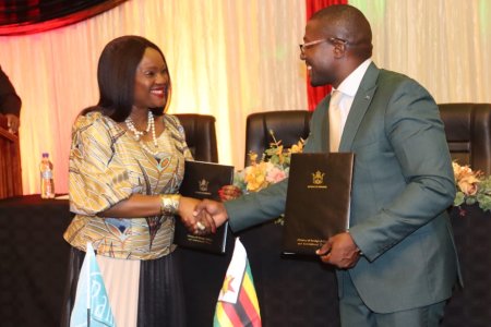 COP Signing Host Country Agreement.png